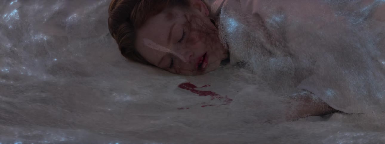 Woman falling to the ground and spitting blood with a glowing mist around her
