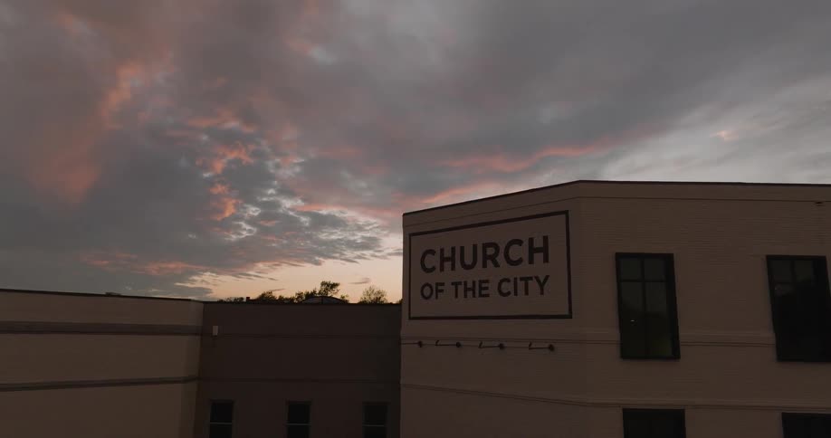 A church sits near a suburban area filled with homes