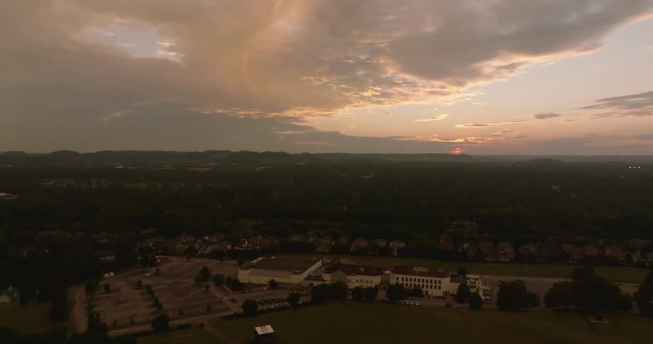 Aerial view of a landscape during twilight with the sky showing shades of blue and orange