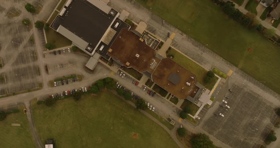 Aerial view of urban and commercial buildings with vegetation around