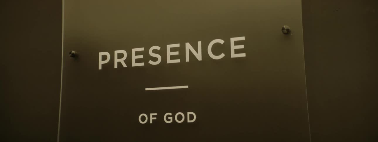 Modern glass plate with a white text on the wall