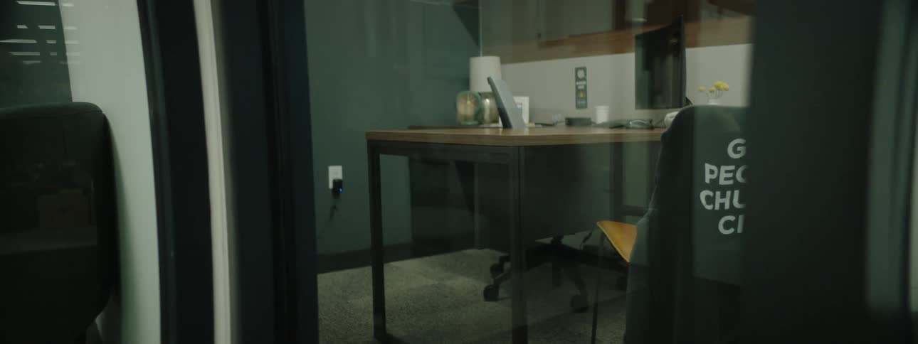 Interior of an office seen through a glass door