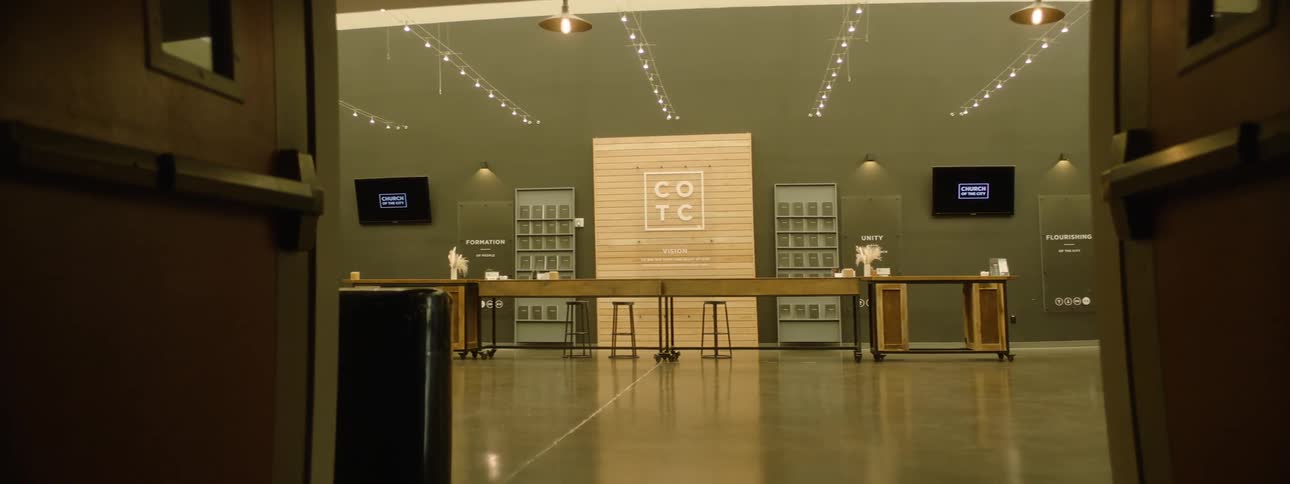 Interior of a bright modern reception with a wooden table