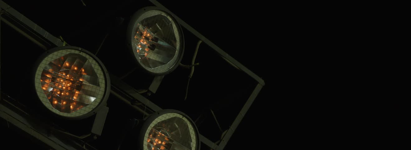 Closeup on three studio lights turning off