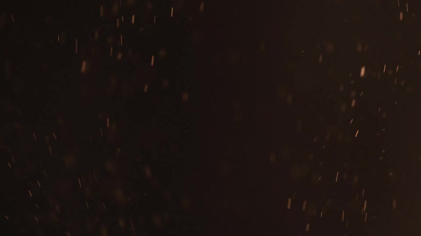 Close up of grains falling down against a dark background