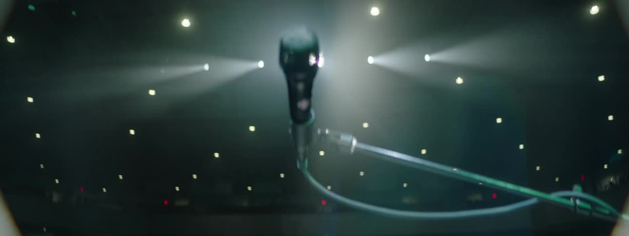 Microphone center stage under soft focused lighting