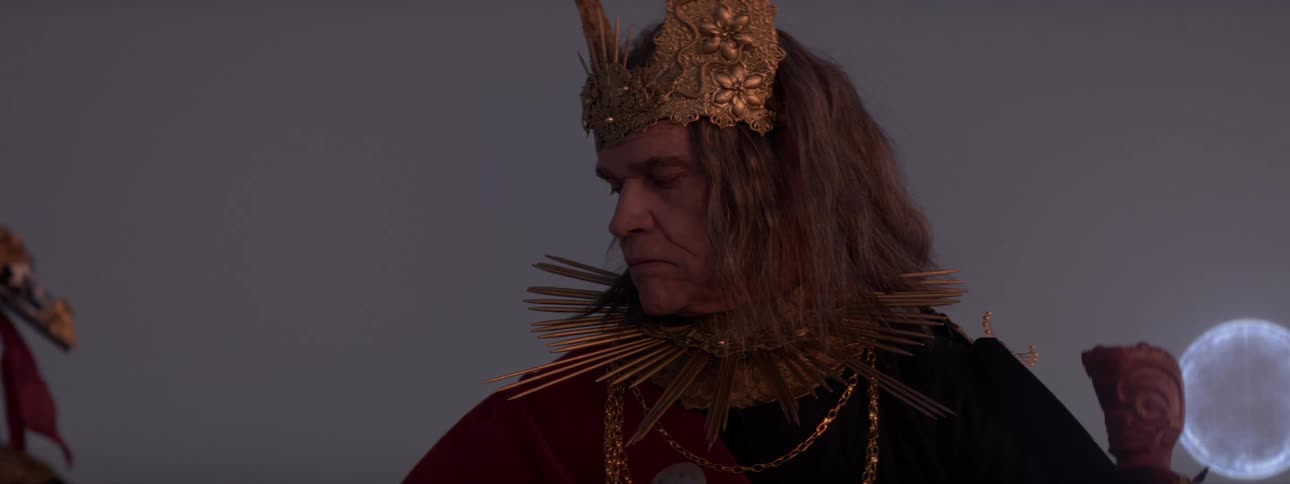 A king nods to a person who walks off