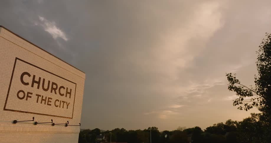 A church with its logo written on the top at dusk