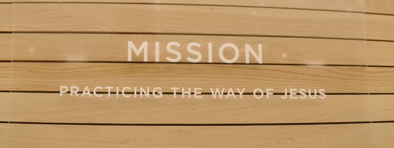Sign in a glass grid fixed to a wooden wall