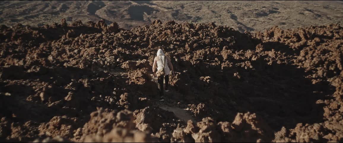 Man walking on rocky terrain