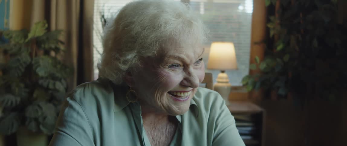 Close up of an elderly woman having a conversation at home