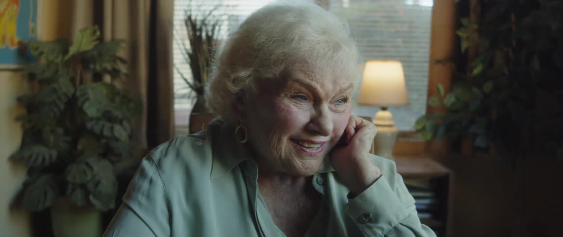 Portrait of an elderly woman talking and laughing