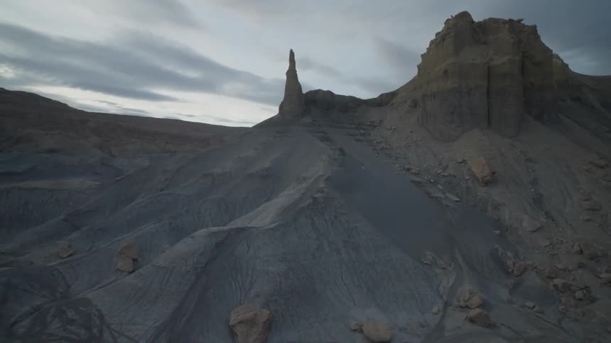 Aerial view of rocks and mountains with sharp peaks on a partly cloudy day