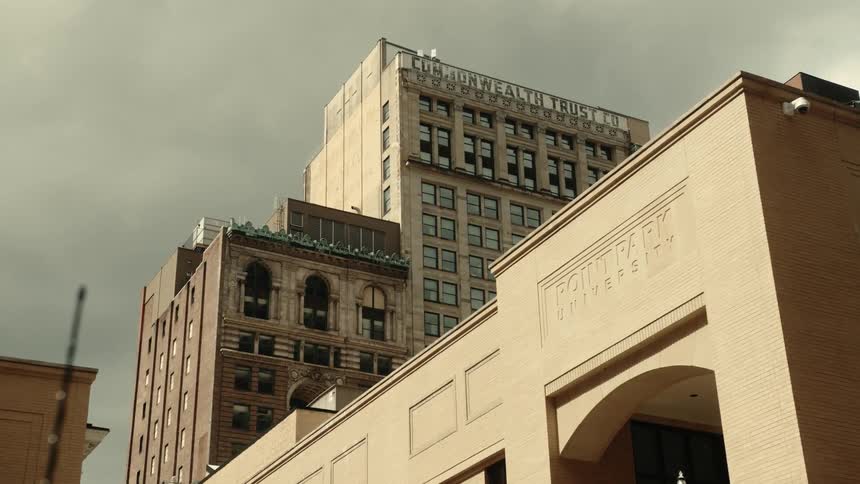Urban and commercial buildings against a cloudy sky in a metropolis