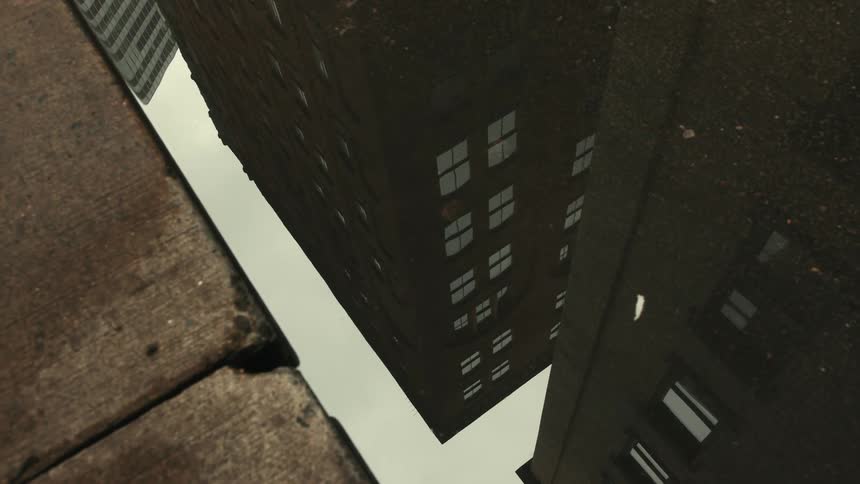Watershed reflecting urban buildings in an alley