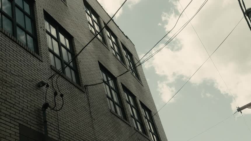 Wall of a residential building on a partly cloudy day