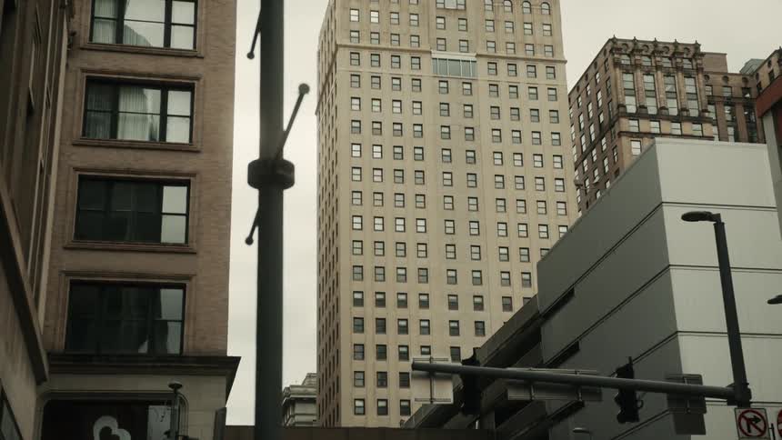 Buildings and skyscrapers in a metropolis on a cloudy day