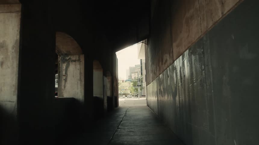 Sidewalk in an arched tunnel in a metropolis