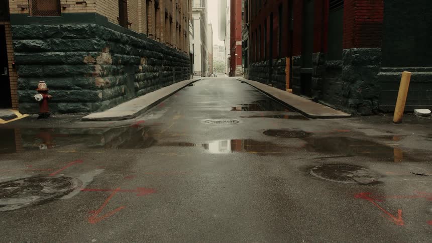 Puddles on the road of a quiet alley in the city