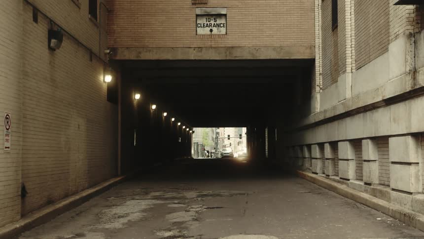 Tunnel beneath a building in a city