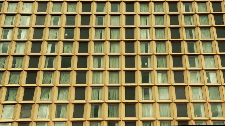 Urban building with windows patterned in a metropolis