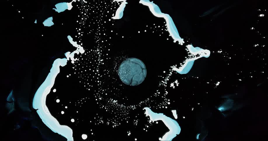Closeup of a liquid substance splashed on a dark surface