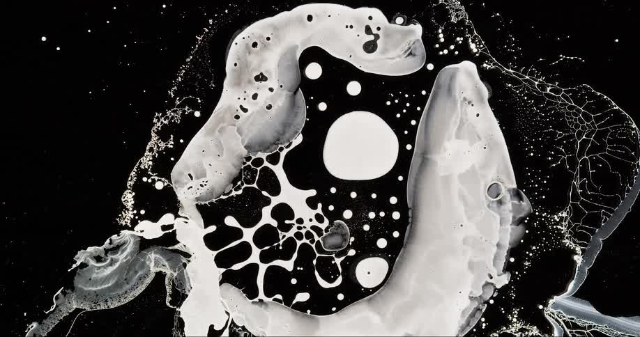 Abstract splashes of white liquid ink on a pattern of droplets and streams against a dark background