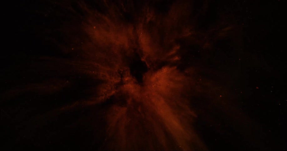 An orange explosion on a black background and then the orange color becomes all dotted