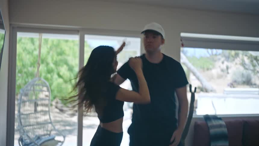 A man and woman are dancing