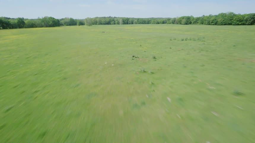 Country roads and farm surrounded by fields and forested areas in rural Arkansas