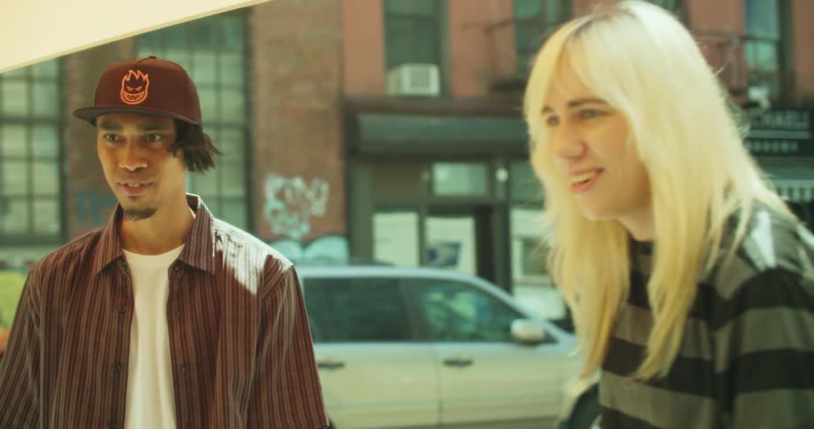 Skater friends chatting on the sidewalk in New York City