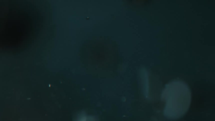 Extremely close to the water spinning and generating bubbles