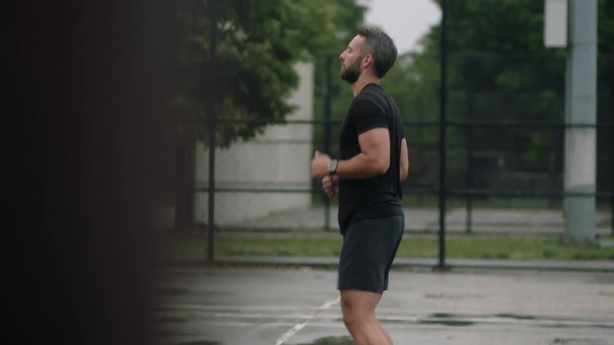 Man doing prerun stretching exercises