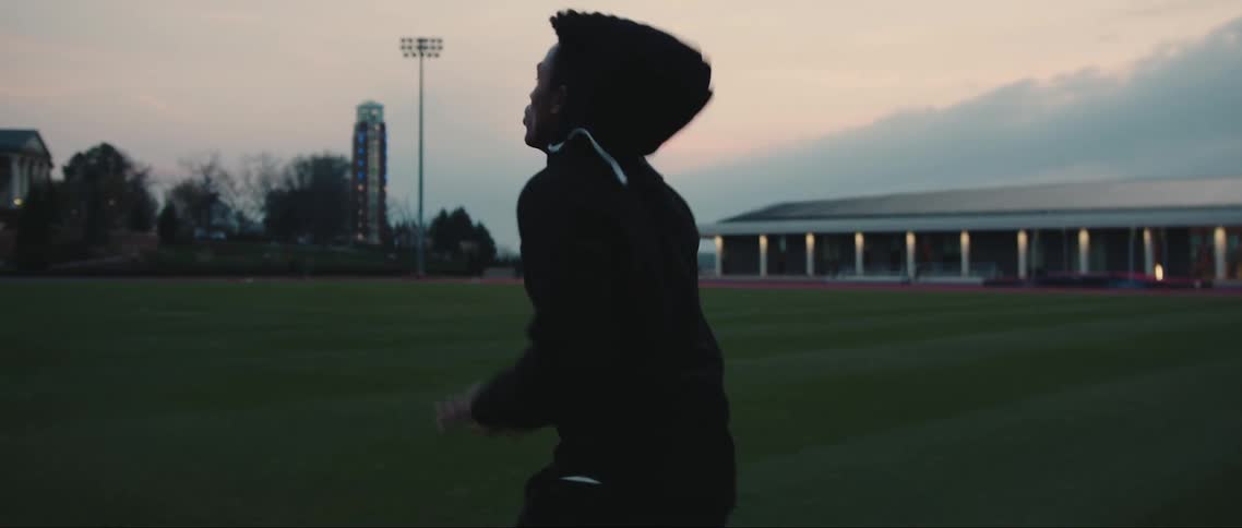 An athlete exercises on a sports field