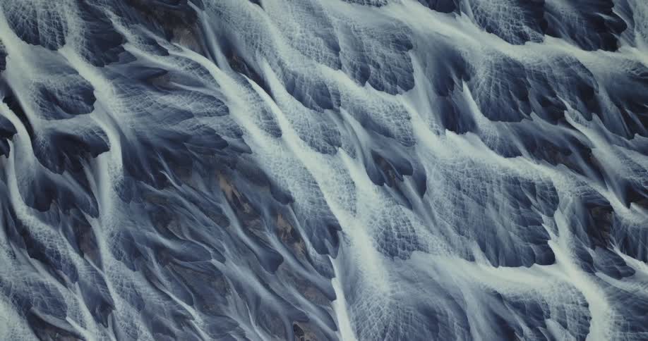 A textured surface with some white lines with left direction styles