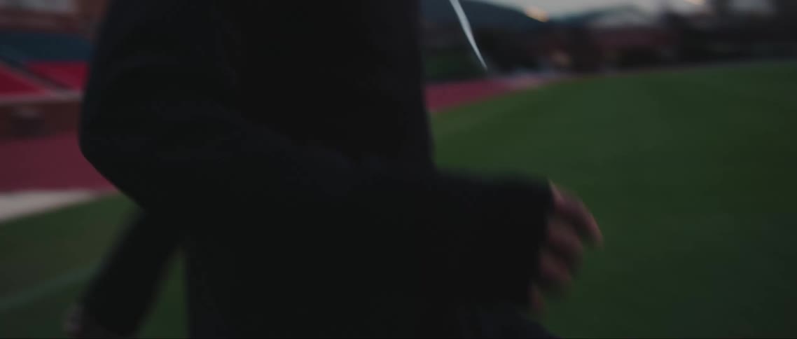 Young boy in a soccer stadium hitting ball
