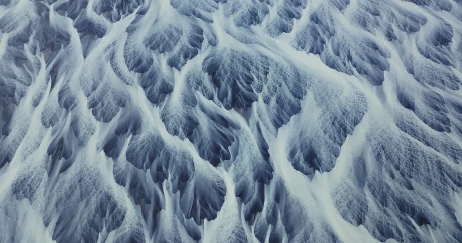 Closeup aerial view of a glacier river