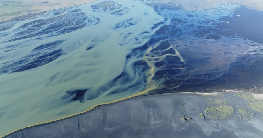 Aerial panorama of gray lands with ice blocks
