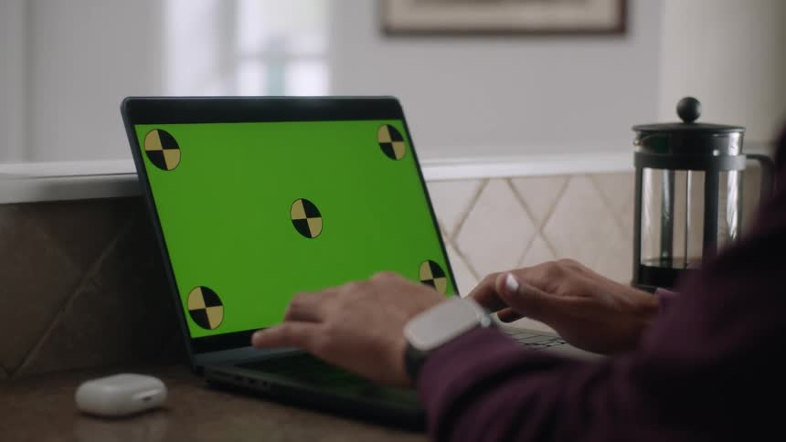 Hands of a person typing on a laptop