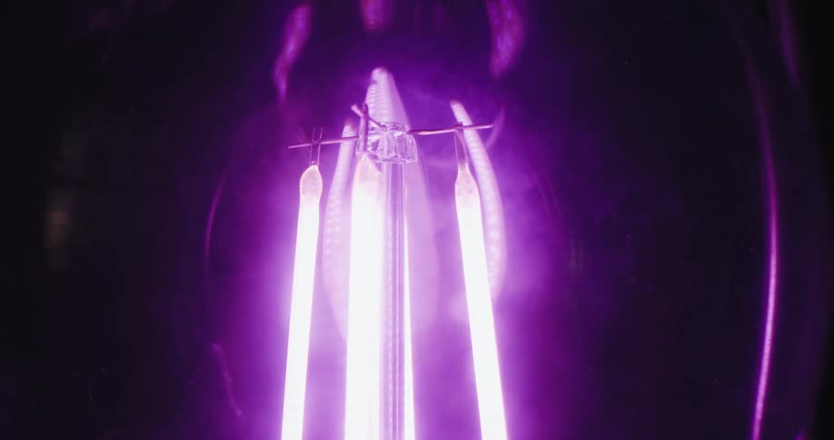 Extreme closeup on a lamp with purple light