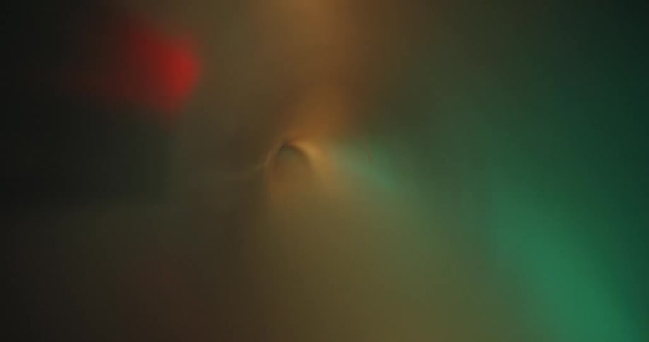 The interior of a semi translucent plastic tube with green lights reflecting outside