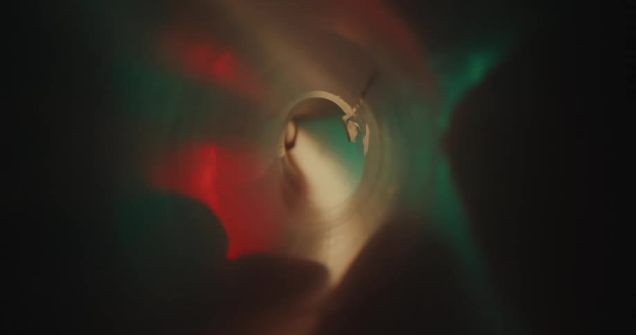Lights reflect inside the tube
