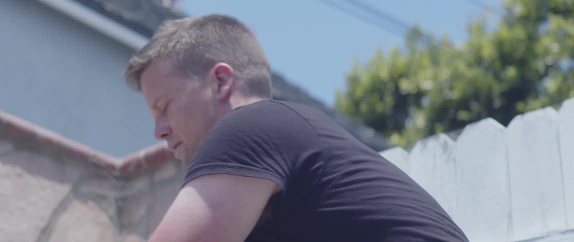 Portrait of a man working in a yard