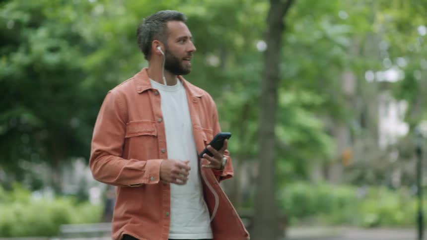 A man talks on his cell phone in the park