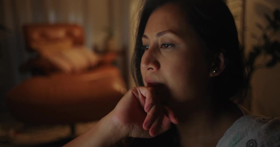 A woman is using her laptop at home