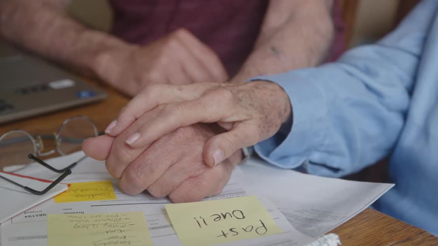 Closeup on the hands of an elderly couple together