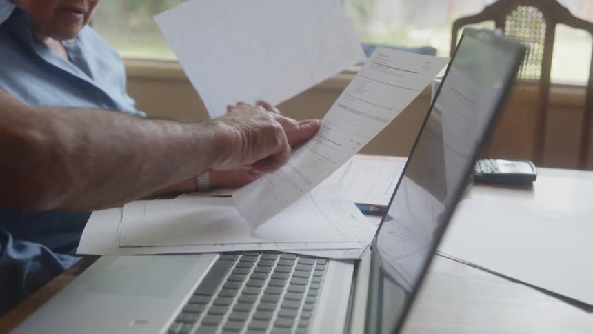 A man and woman read forms together