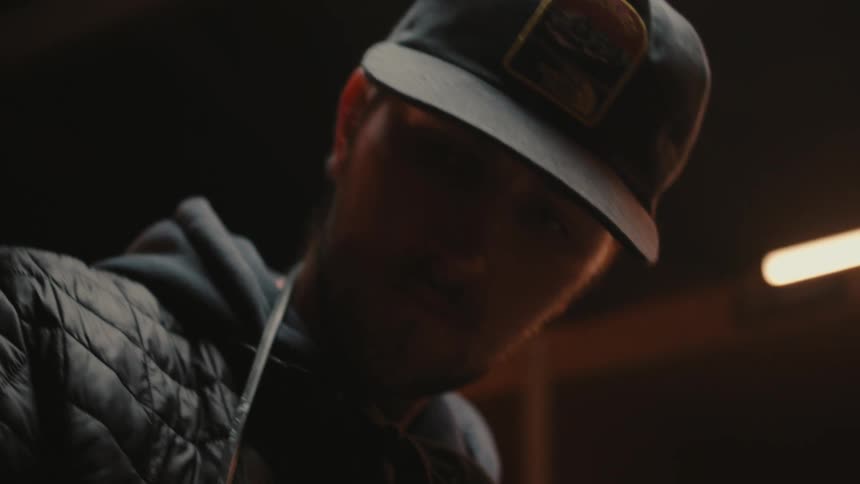 Portrait of a man in a room with low lighting