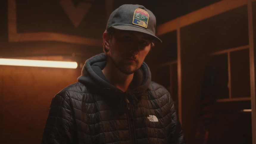 Portrait of a man inside a room with low lighting