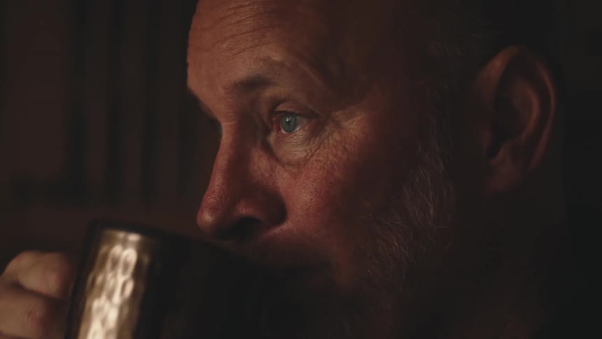 Portrait of a man drinking a mug